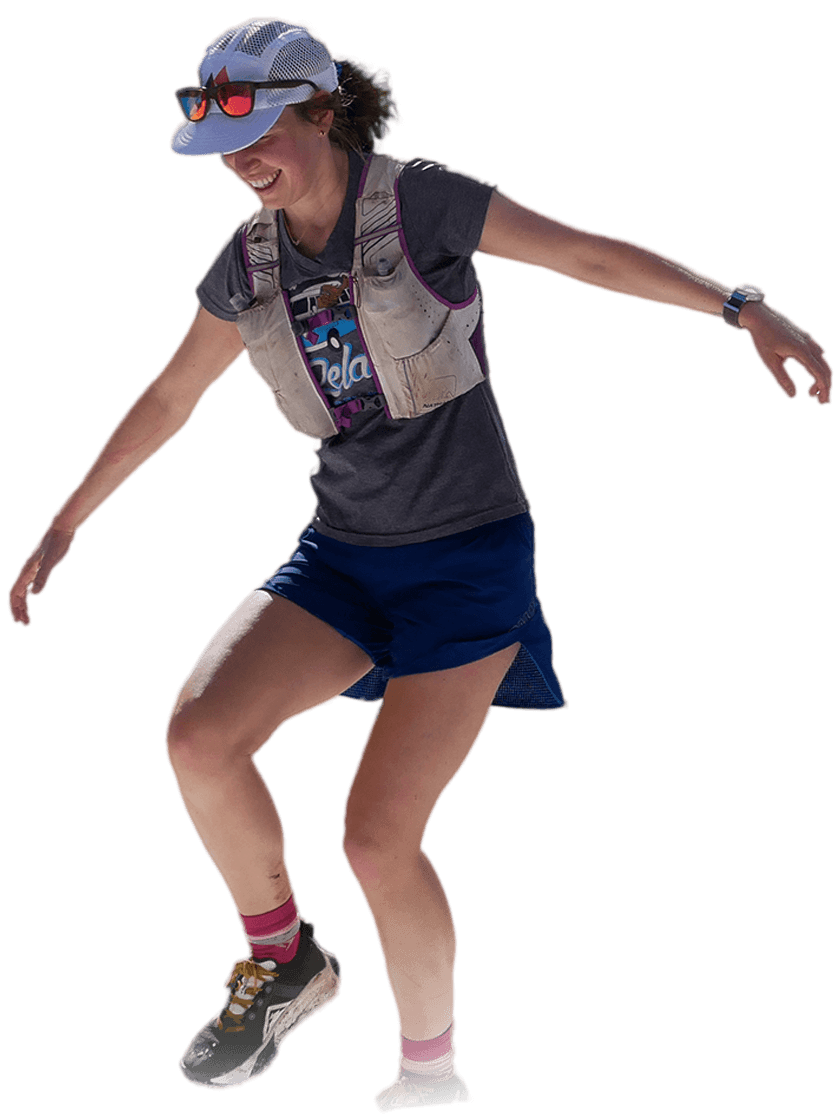 Two female ultra-marathon runners cheering joyfulling while looking at the camera