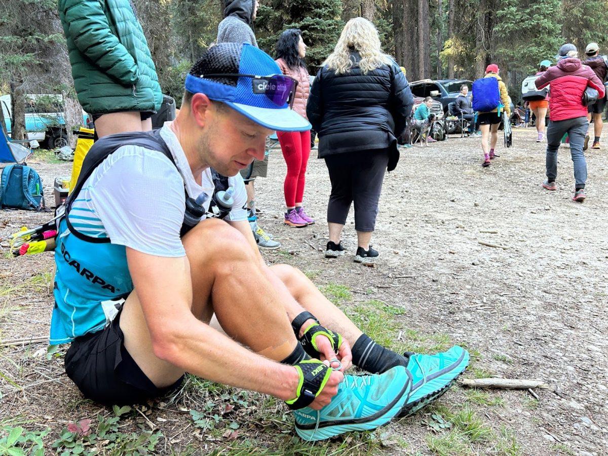 Gabe Joyes (2023) changing to more technically capable shoes at first crewed aid station, photo by Jenny Joyes